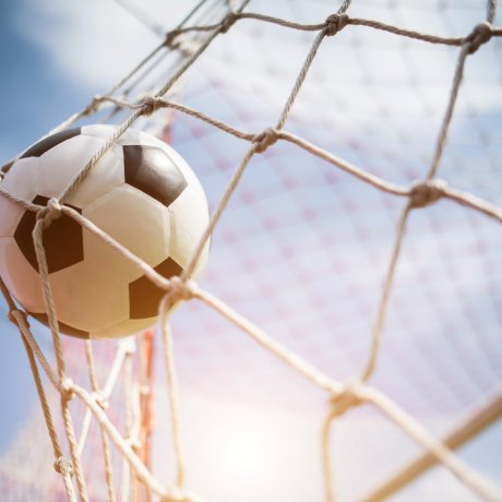 Soccer into goal success concept